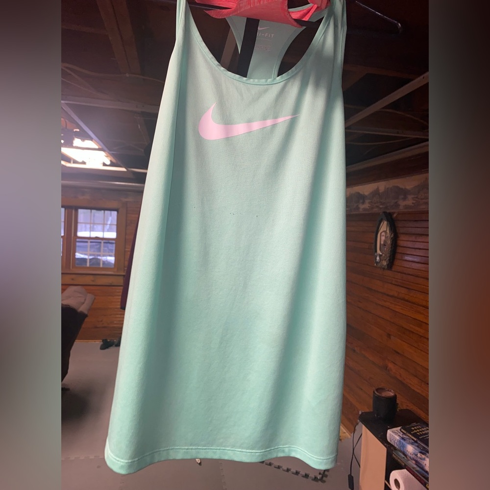 Got 2 Nike tanks. Just about small for me. Both medium.